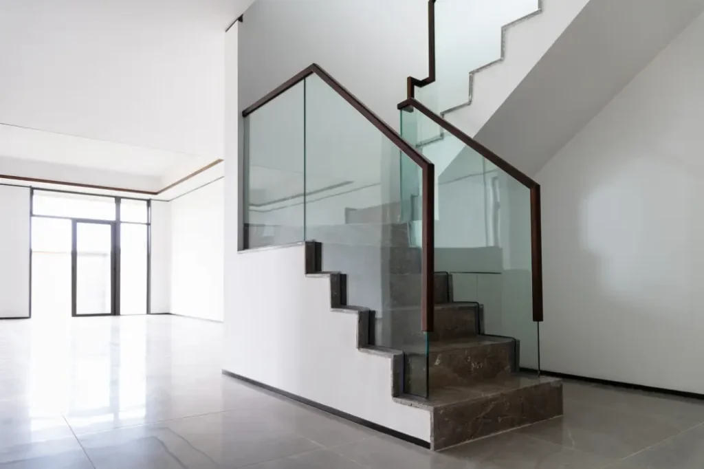 glass railing on stone stairs